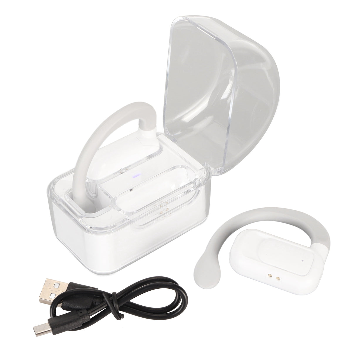 Open-ear translator earbuds with their clear charging case and USB cable